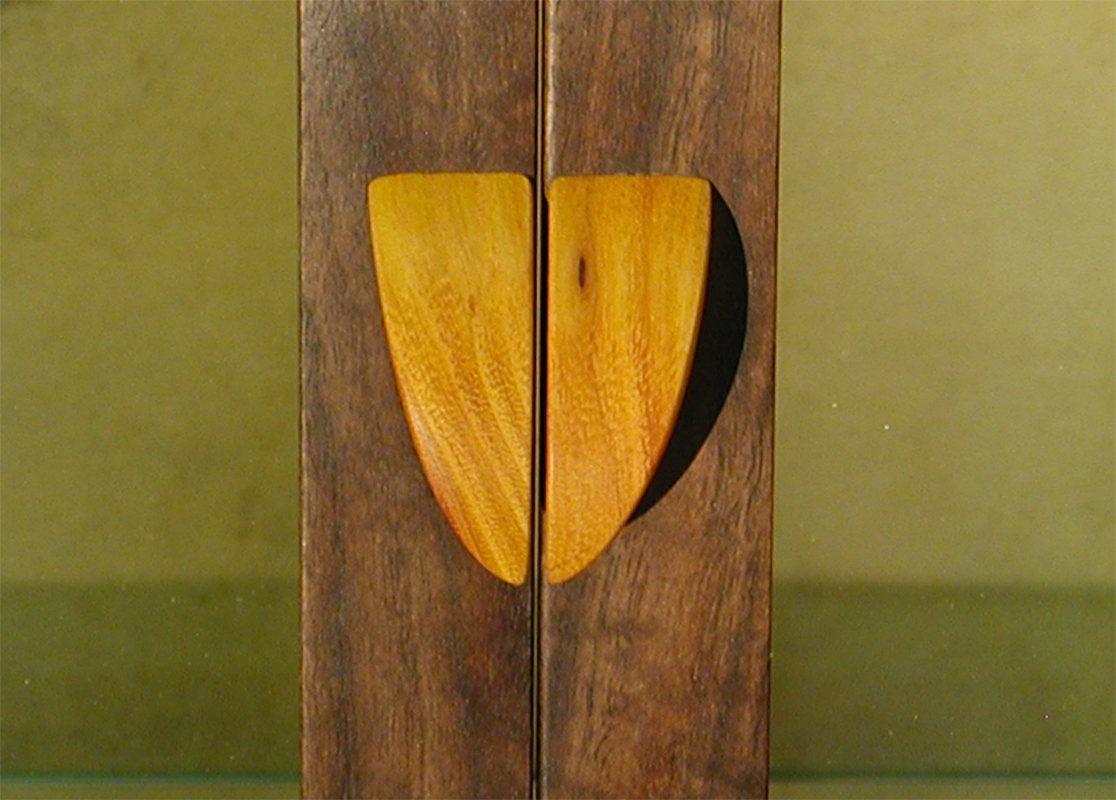 Display Cabinet detail of the pulls in Osage Orange