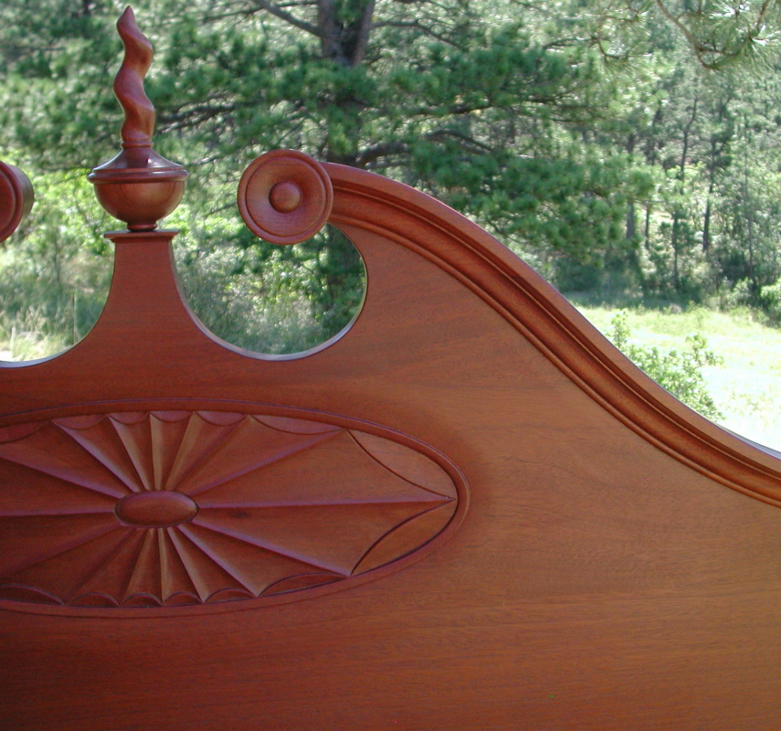 18th century four poster bed detail of the sunburst on the headboard